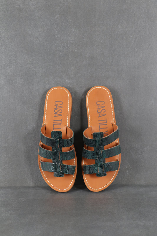 Mules plates en cuir bleu texturé pour femmes. 